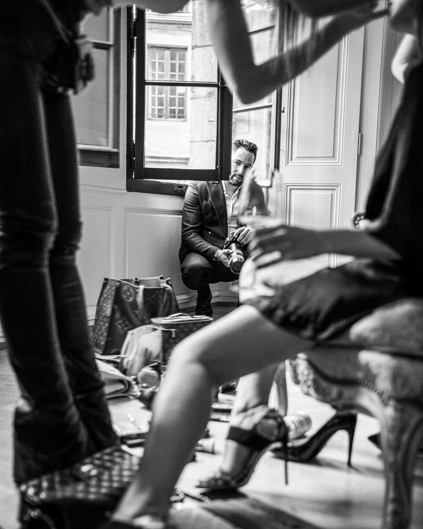 Behind the scenes of a shoot with a model in high heels